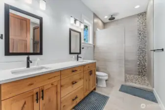 Ensuite bathroom with double vanity and beautiful tiled shower