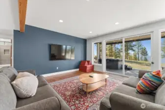 Daylight basement living room with sliders to outside patio