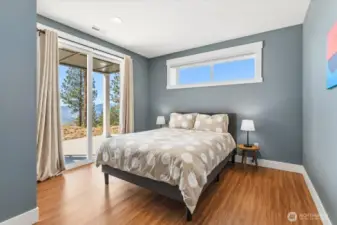 Guest bedroom with slider to access the coverd patio