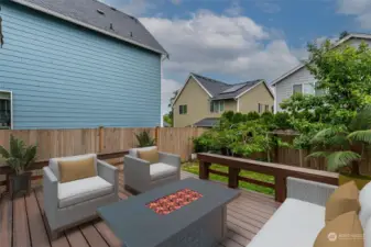 Staged. Entertain in style from the beautiful wood deck with built-in railings.