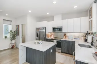 1/2 bath to the left of the kitchen. Stainless appliances all stay