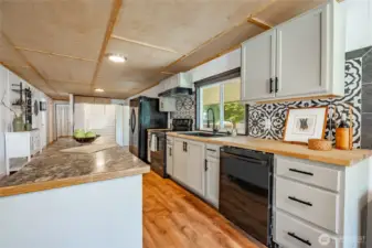 Updated kitchen with island is great space to cook.