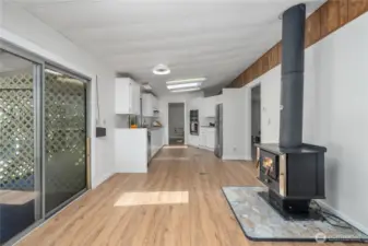 Looking back toward the kitchen from the bonus area. The lattice out the slider is an enclosed privacy area on the deck.