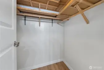 The primary suite offers this walk-in-closet just inside the bathroom. Convenient location and room to add a customized system.