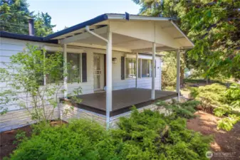 Grand entrance to the home, overlooking mature shrubs and low-maintenance yard.
