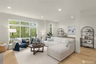 Sunlight spills into this inviting great room, where every window feels like a frame-worthy view.