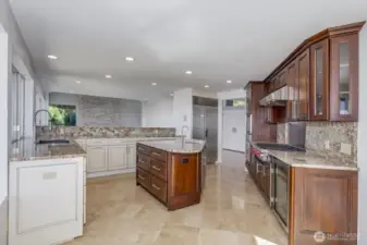 Looking through the kitchen to the living room. Note the Sub Zero refrigerator.