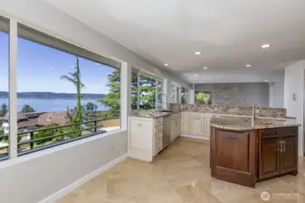 On summer evenings you can pass the libations and snacks out through the kitchen window to your guests enjoying the sunset.