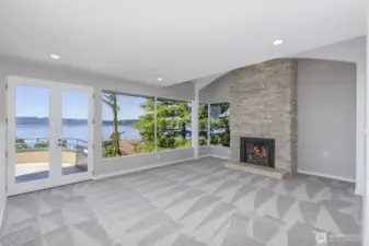 Enjoy warm and cozy evenings in front of the gas fireplace with floor to ceiling stone. Note the high ceilings and large windows to capture the view.