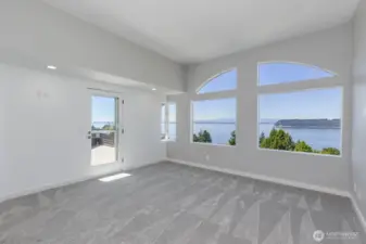 The primary bedroom with private view deck. You lay in bed and enjoy the view.
