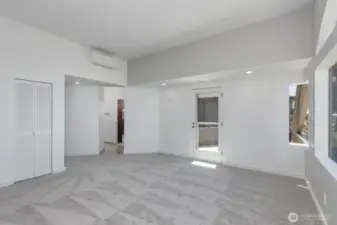 Looking the other diretion in the primary bedroom with the full bath through the door on the left.