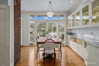 That opens onto the deck and lushly landscaped backyard