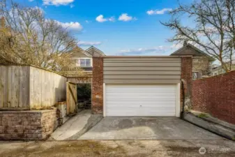The detached one car garage located in the alley. Super high ceilings and loads of space. Perhaps this could be an art studio!