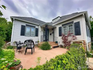 This 1934 home captures the enduring appeal of Cape Cod architecture. This front patio space is perfect for morning coffee and afternoon wine.