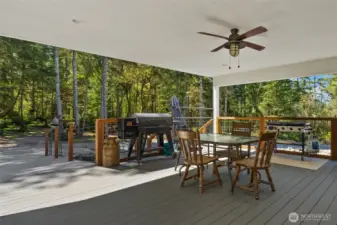 A large covered outdoor living area will quickly become your favorite summer hangout, featuring access to an expansive deck, pool, and hot tub for the ultimate summer experience.