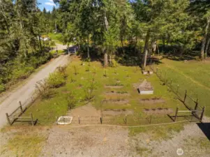Meticulously designed, this self-sustaining orchard is fully fenced and features an integrated irrigation system for all plants.