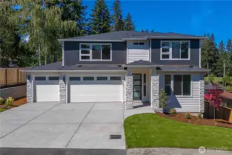 Home is a 3 car garage, but exterior style will be more farmhouse - like next photo. For Marketing purposes only