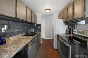 The kitchen is easy to work in and features abundant counter space and storage.