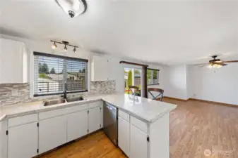 Kitchen w/ eating bar.  Opens to family room.  Air conditioned, too!