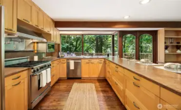 The large kitchen has lots of storage and plenty of work space surfaces.