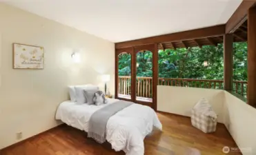 Bedroom 4 on the upper level with access to balcony.