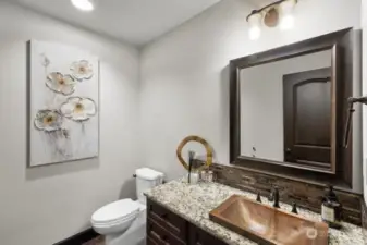 Powder room in daylight basement.