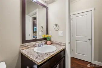 Main level bathroom adjacent to laundry