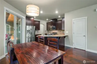 Dinging area with easy access to kitchen, living room, and outside deck
