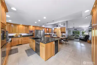 HUGE kitchen, large island, cabinets wrap around kitchen, dining area, and pantry wall.
