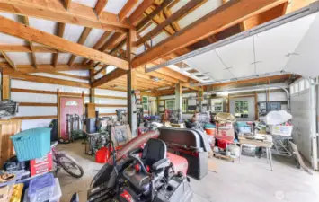 Shop is insulated, and has a loft for extra storage or hobby area. Covered and paved carport on the side.