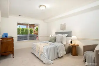 A well appointed guest suite features its own en suite bathroom and a generous walk-in closet.