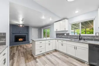 Newer gourmet kitchen with family room and eating bar.