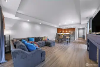 Wide open great room with updated flooring and recessed lighting, creating a bright and inviting main level.