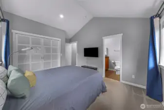 Spacious primary suite featuring generous closet space and direct access to the private ensuite bath.