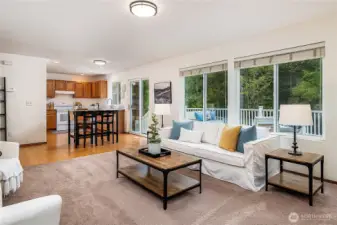 The kitchen opens to the family room, making it easy to entertain, watch TV while cooking, and enjoy views of the greenbelt through the many windows.