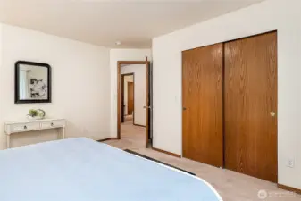 Primary Bedroom facing hallway. Large  Walk-In Closet on the right.