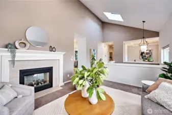 The living room shares the fireplace with the family room, just opposite the wall on the left!