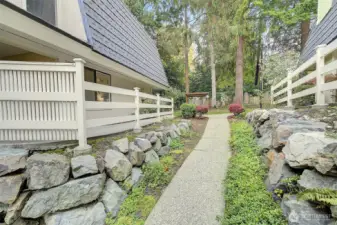 There are no steps to climb to reach this ground floor condo home.....just follow the path up to the bushes and turn left.  Enter the front door and #1315 is the corner home on the right.