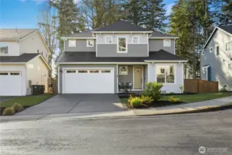 Nestled on a quiet cul-de-sac of just seven homes on Crystallia, this thoughtfully designed residence enjoys peaceful privacy and views overlooking Liberty Bay. Surrounded by evergreens, it offers a perfect blend of modern comfort, natural beauty, and a close-knit neighborhood feel.