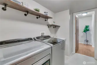 Laundry room w/utility sink. W&D stay
