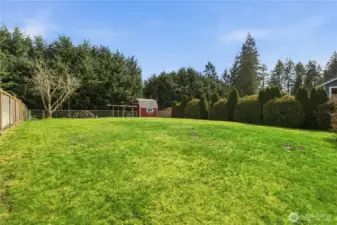 Fully fenced backyard, sprinkler system front & back