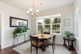 This lovely dining area invites you to settle in and stay for awhile. Enjoy peaceful views from expansive windows while you relax.