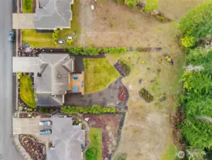 Another view from above with careful landscaping along both sides of the back of the property ensuring private, peaceful living. Welcome home to warm, gracious living in the heart of the Olympic Peninsula!