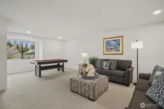 Extra large family room has space for media room and game area.