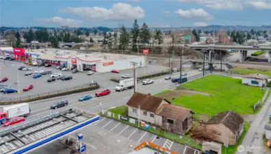 Across from major grocer and next to Arco.