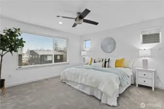 Large Primary bedroom with so much natural light. The spacious room offers a tranquil escape, flooded with sunlight throughout the day.
