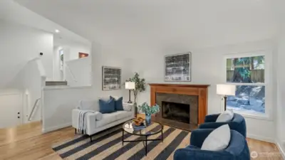 The Great room is highlighted by a wood burning fireplace featuring a gorgeous wood mantle accented by granite surround.