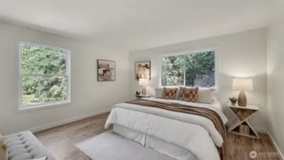 Spacious primary suite with large windows