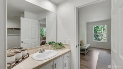 Large walk-in closet seen in the mirror.