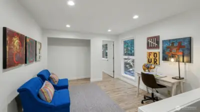 Upstairs Bonus/loft is the ready for your desk, crafts, or TV viewing. Door in the distance leads to sunlit secondary bedroom